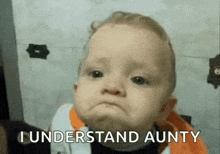 a baby is making a funny face and saying `` i understand aunty '' .