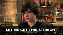 a young boy is sitting at a table and says let me get this straight netflix