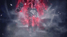 a person is standing in a dark room with red lightning coming from behind them