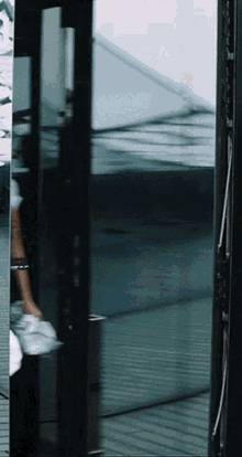 a blurry picture of a person walking through a door