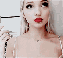Dove Cameron Thinking GIF - Dove Cameron Thinking Red Lips GIFs