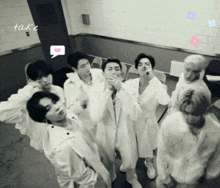 a black and white photo of a group of young men with a speech bubble that says take on it