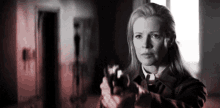 You Cant Shoot Me I Took The Bullets Out GIF - You Cant Shoot Me I Took The Bullets Out Lady Scared Holding A Gun GIFs