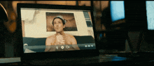 a laptop with a picture of a man on the screen