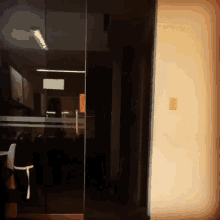 a light switch on a wall next to a door