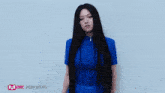 a woman in a blue dress with four written on it