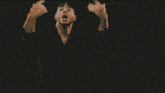a blurry picture of a person 's face with a green background