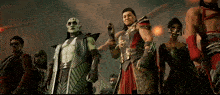 a group of people standing next to each other with one wearing a green mask