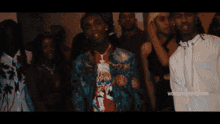 a group of people are swimming in a swimming pool with the words worldstarhiphop.com on the bottom