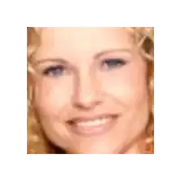 a close up of a woman 's face with blue eyes