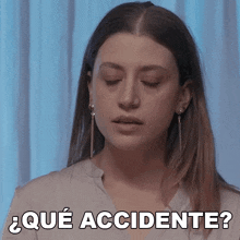 a woman with her eyes closed says " que accidente " in spanish
