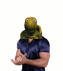 a man in a blue shirt has a picture of a turtle in front of his face