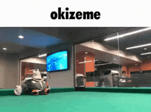a pool table with the word okizeme on the bottom