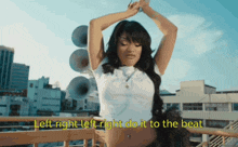 a woman is standing on a balcony with the words left right left right do it to the beat