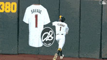 a baseball player for the oakland athletics is kneeling down