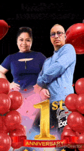 a man and a woman standing next to each other with red balloons and a 1st anniversary banner
