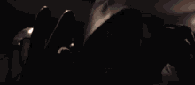 a blurred image of a person in a dark room
