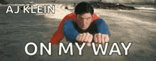 superman is flying through the air in the ocean with the words aj klein on my way .
