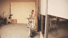 The Concept Of Trying To Look Good While Exercising Is Still A Worry. GIF - Miley Cyrus Bicycle Gym GIFs