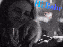a black and white photo of a woman and a man with the words hi babe on the bottom