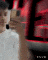a man is taking a picture of himself with his phone