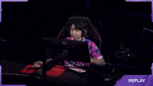 a purple background with a person in a pink shirt that says hyperx on it