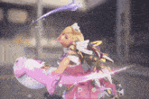 a girl in a pink dress is holding a pink whale