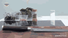 a knife sits on a cutting board next to bowls of vegetables and a bottle of salt