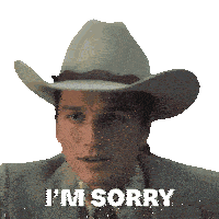 a man wearing a cowboy hat and a suit says i 'm sorry