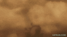 a gif from gifrun.com shows a man in armor with a surprised look on his face