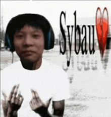 a man wearing headphones and a white shirt with sybeau written on the front