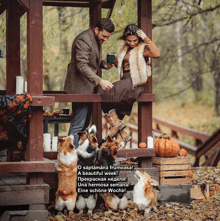 a man and woman sitting on a porch with dogs