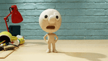 a cartoon character with a surprised look on his face stands on a desk