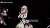 a girl is singing into a microphone on a stage in front of a castle