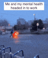 a person walking down a street with a box that says me and my mental health headed in to work