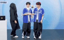two baseball players wearing jerseys with the number 97 on them