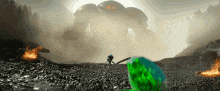 a green frog is standing in front of a large robot .