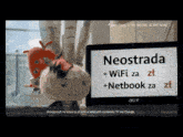 a cartoon character standing next to an acer laptop