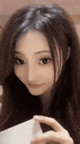 a close up of a woman 's face making a face