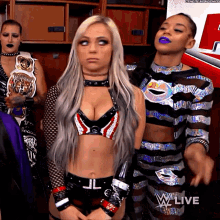 liv morgan looking around looking left and right uhm when two people are arguing next to you