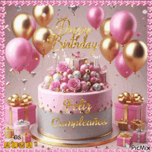 a pink and silver birthday cake with pink balloons and gifts