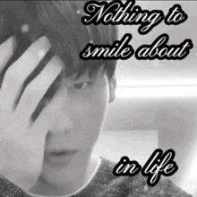 a black and white photo of a man with the words " nothing to smile about in life " below him
