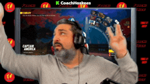 a man wearing headphones playing captain america