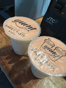 a jtc omniblend blender sits next to two cups of sweet taste