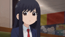 a girl with long black hair is wearing a blue suit and a red tie