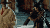 a man carrying a cross with the words god is an american behind him