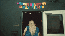 broken branches family reunion is advertised on a black building