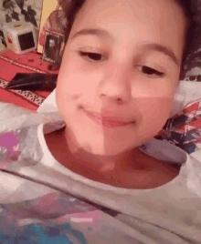 a close up of a young girl 's face with a shadow on her face