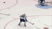 a hockey game is being played in front of a banner for tim hortons