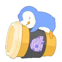 a blue penguin is sleeping on top of a cup of coffee